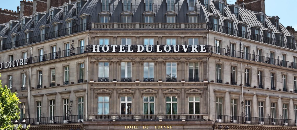 PARIS, FRANCE - JUNE 11, 2014: Facade of the Grand Hotel du Louvre, Hyatt Hotel in Paris. Located near Louvre Palace in a beautiful historic building builted in 1895.Paris, France - June 11, 2014: Facade of the Grand Hotel du Louvre, Hyatt Hotel in Paris. Located near Louvre Palace in a beautiful historic building builted in 1895.